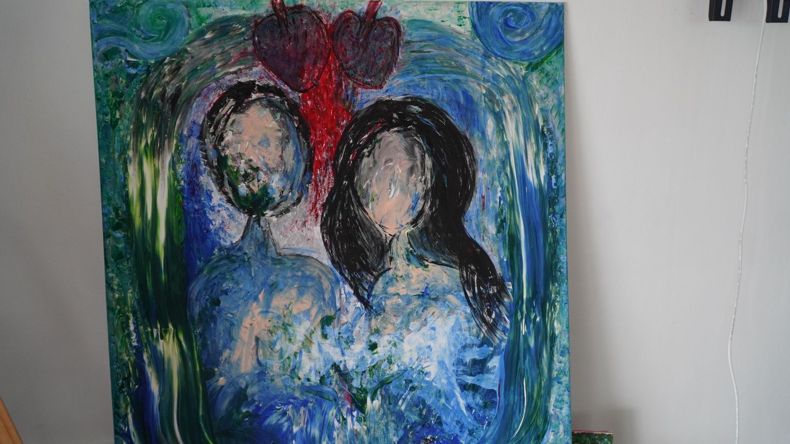 Couple with heart above, blue and green tones